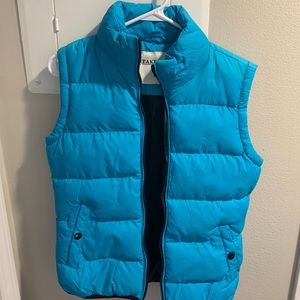 Blue vest, black on inside. Never worn.